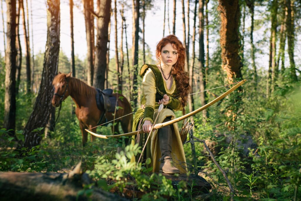 Fantasy medieval woman hunting in mystery forest